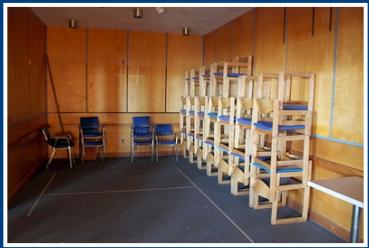 CHAIRS STACKED IN THE BAR ROOM UPSTAIRS